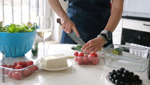 Woman S Hands Are Slicing Cucumber For Greek Salad With A Glass Of White Wine Nearby