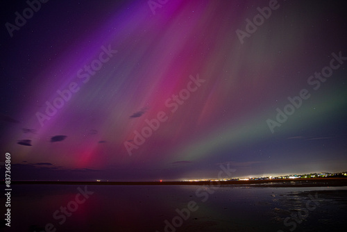 Northern lights / aurora over Dublin Bay in Ireland after G5 solar storm
