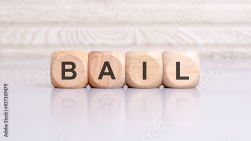 Wallpaper Mural the word bail is written on a wooden blocks structure. Blocks on a bright gray background. selective focus Torontodigital.ca