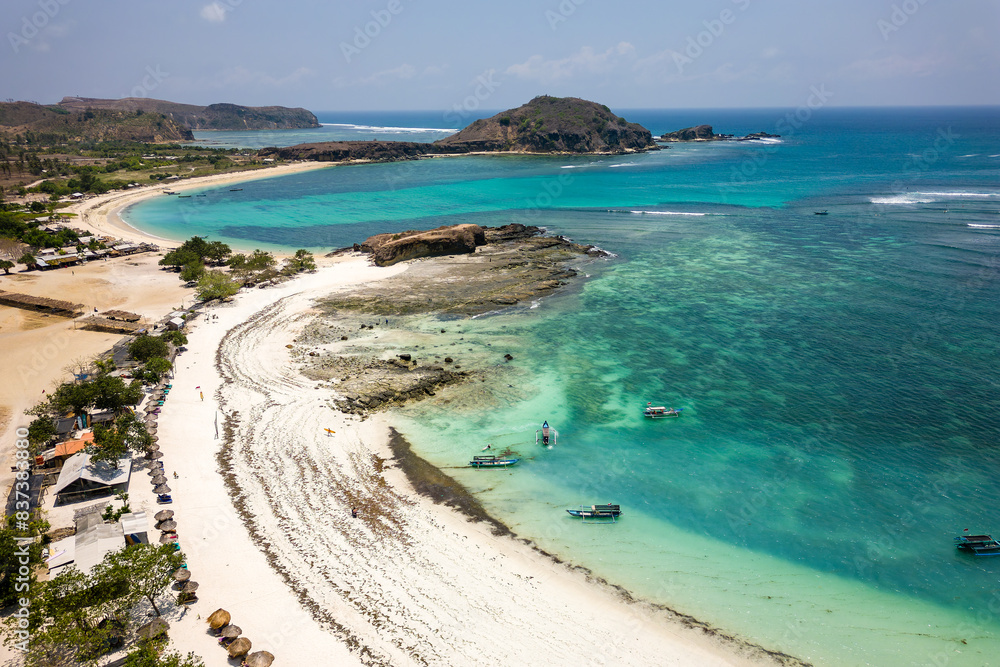 Aerial view of a spectacular sandy tropical beach and warm ocean (Tanjung Aan, Lombok, Indonesia) Aerial view of a spectacular sandy tropical beach and warm ocean (Tanjung Aan, Lombok, Indonesia)