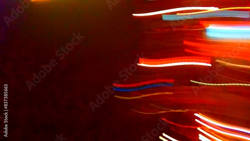 Chaotic movement of spots of all colors. Bright colors. Night city lights. Screensaver. Video art graphics.