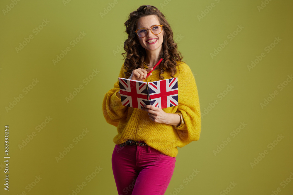 happy fit woman in sweater and glasses against green happy fit woman in sweater and glasses against green
