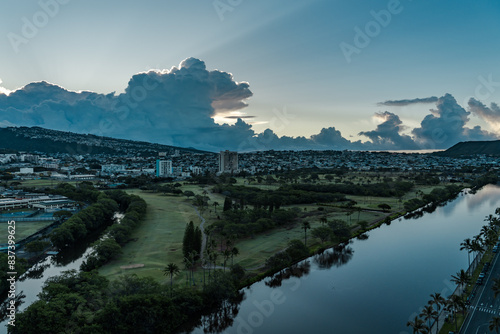 Ala Wai Golf Course / Kaimuki / Kapahulu, Sunlight shining through clouds, giving rise to crepuscular rays，Honolulu Oahu Hawaii. photo