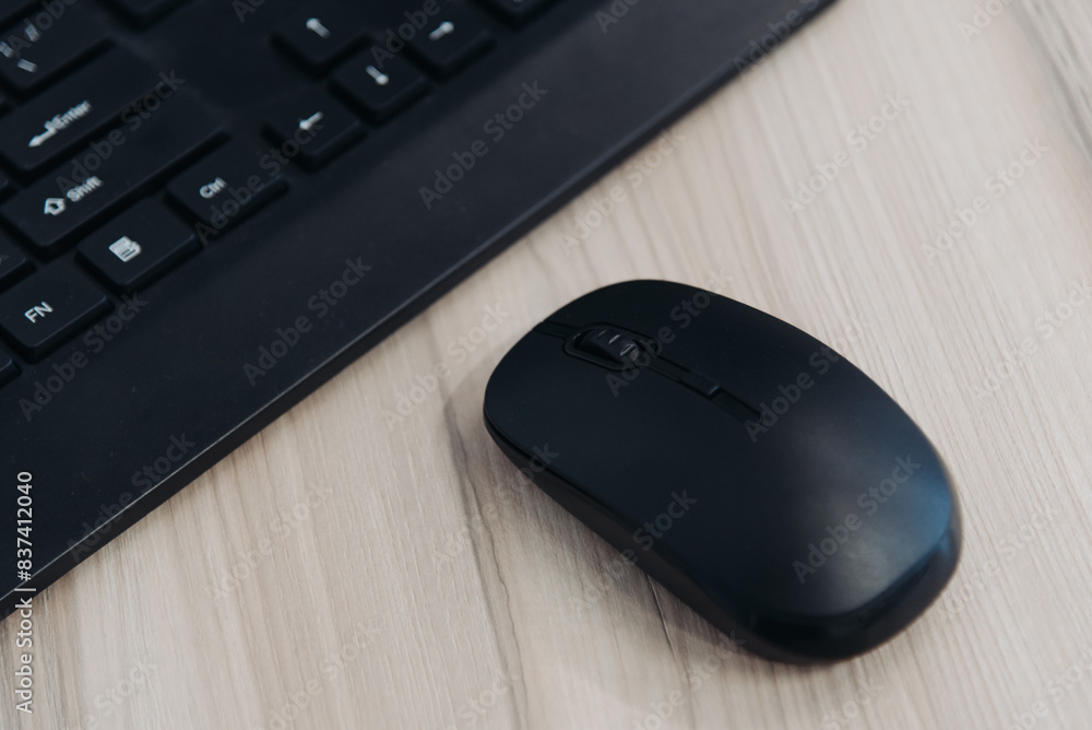 wireless computer mouse and keyboard on office desk, cropped wireless computer mouse and keyboard on office desk, cropped
