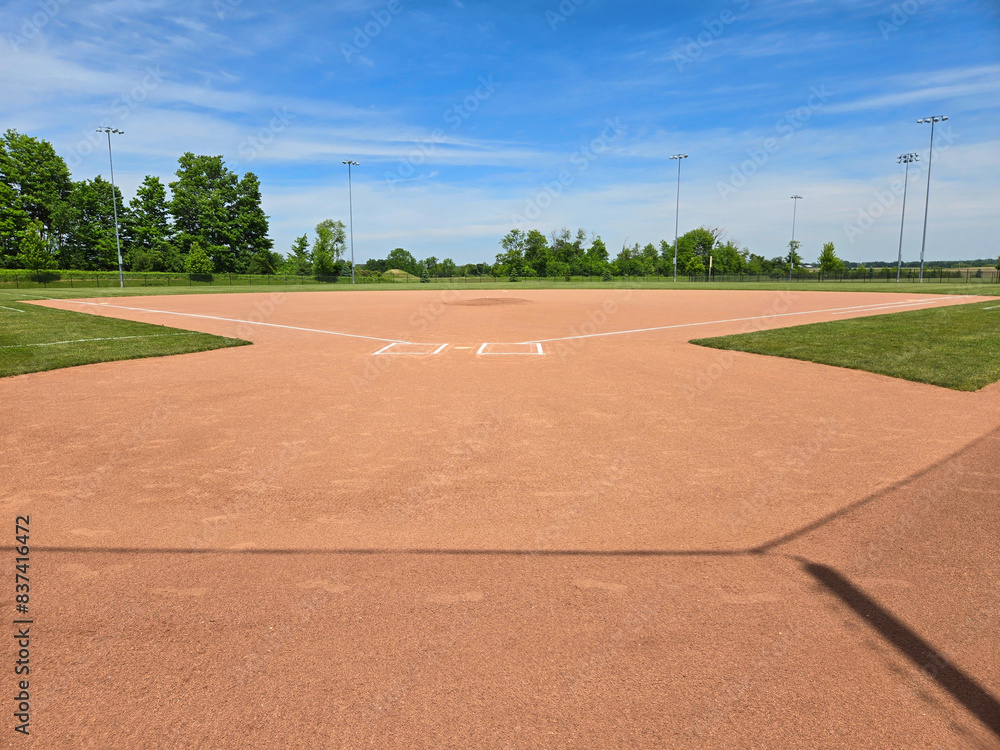 A perfect looking baseball field shot on a sunny day.