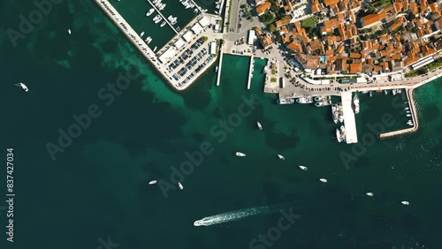 Biograd na Moru, aerial above view of city port with beautiful architecture and sailing boats and luxury yachts at stone pier. Scenic historic harbor on Adriatic Sea coast, Dalmatia region in Croatia