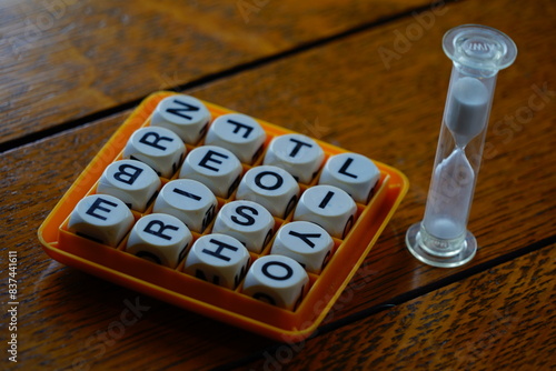 Jumbled up letters in a board game matrix with a salt timer