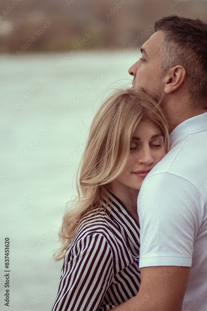 Man hugging woman, woman with eyes closed. Man hugging woman, woman with eyes closed.