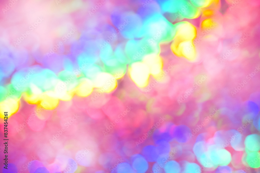 Rainbow background, blurred effect. Glowing holiday light circles are created from bokeh in the camera and lens. Background for design. Rainbow background, blurred effect. Glowing holiday light circles are created from bokeh in the camera and lens. Background for design.