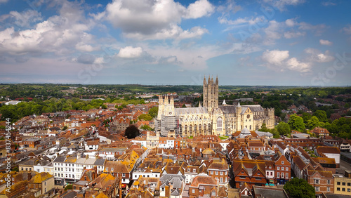 Flight over the city of Canterbury United Kingdom with famous Canterbury Cathedral on a sunny day - aerial view - CANTERBURY, ENGLAND - MAY 24, 2024