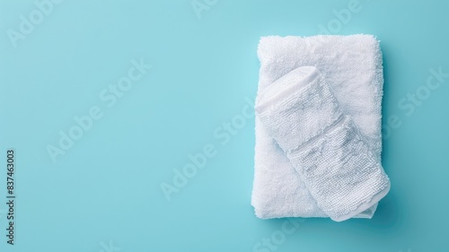 White towels on each other against blue background