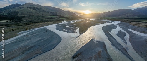 The Waiau Uwha river and mountain range at sunset. Hanmer Springs, Culverden, Canterbury, New Zealand. photo