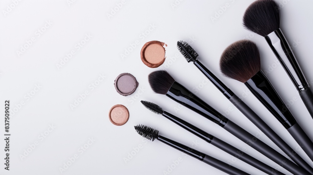 Minimalistic setup of makeup brushes and eyeshadow, bright and clean, isolated on a white background. Perfect for highlighting professional makeup tools and beauty products. Minimalistic setup of makeup brushes and eyeshadow, bright and clean, isolated on a white background. Perfect for highlighting professional makeup tools and beauty products.