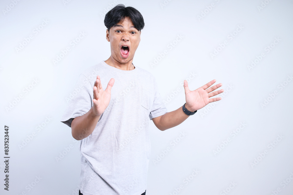 Potrait Of Excited Young Asian Guy Funny Suprised For DIscount Sale Isolated On White Background Potrait Of Excited Young Asian Guy Funny Suprised For DIscount Sale Isolated On White Background