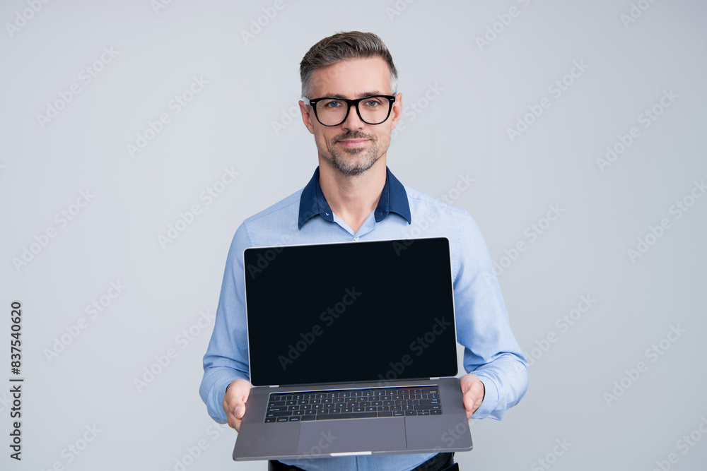 Successful business man using laptop. Businessman work online. Online marketing manager. Business success. CEO manager businessman isolated on grey. Video conferencing Successful business man using laptop. Businessman work online. Online marketing manager. Business success. CEO manager businessman isolated on grey. Video conferencing