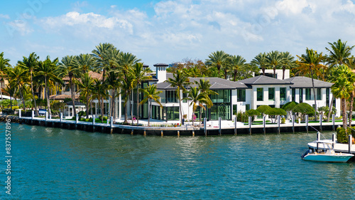 Summer vacation in tropical paradise resort. Luxury summer villa with yacht pier. Vacation in summer paradise. Luxury resort at summertime. Travel to tropical bay of Florida. Serene exotic landscape