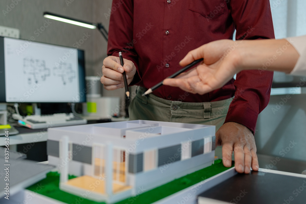 two architects are discussing about new project of the biggest housing estate company who hire their architecture company to design the best construction two architects are discussing about new project of the biggest housing estate company who hire their architecture company to design the best construction