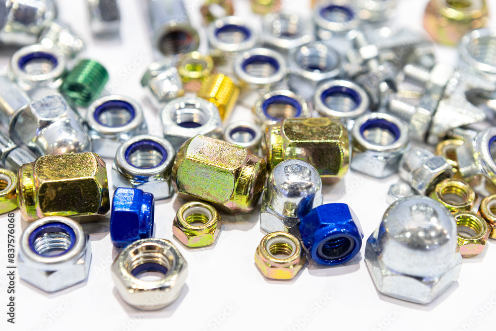 Steel fasteners, bolts and nuts are used in construction.