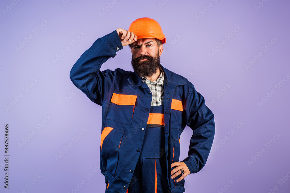 Serious funny builder worker. Handyman builder in hardhat. Building concept. Builder foreman. Man in helmet studio portrait. Engineer worker in hardhat. Construction site manager. Serious funny builder worker. Handyman builder in hardhat. Building concept. Builder foreman. Man in helmet studio portrait. Engineer worker in hardhat. Construction site manager.