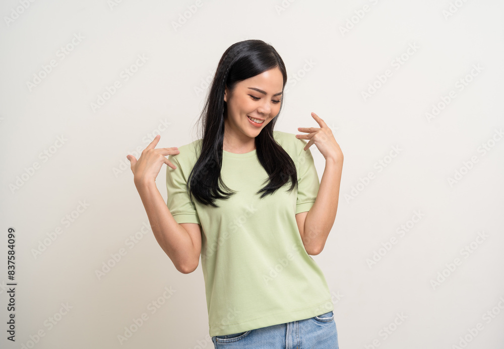 Beautiful smiling happy young asian woman age around 25 in green shirt. Charming female lady standing pose on isolated white background. Asian woman people confident with backdrop. Beautiful smiling happy young asian woman age around 25 in green shirt. Charming female lady standing pose on isolated white background. Asian woman people confident with backdrop.