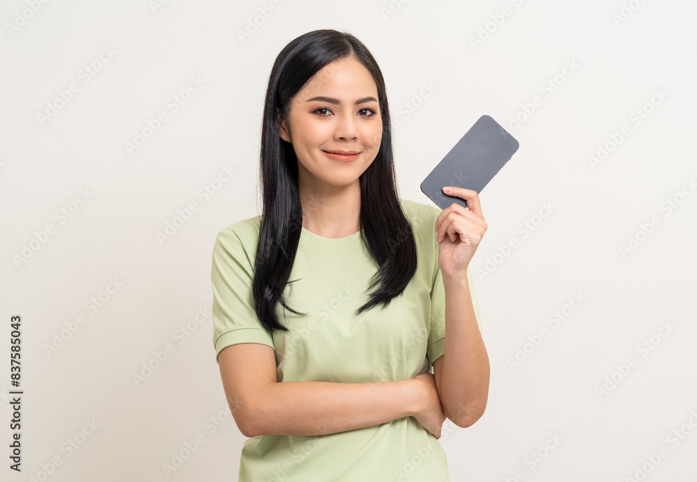 Pretty young asian woman using cellphone standing on isolated white background. Happy Excited Beautiful young asian shopping online payment with mobile phone. Playing game on smartphone Pretty young asian woman using cellphone standing on isolated white background. Happy Excited Beautiful young asian shopping online payment with mobile phone. Playing game on smartphone