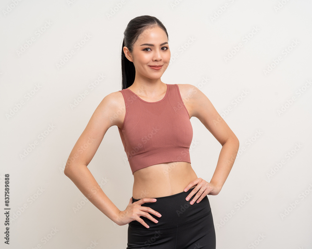 Young beautiful smiling asian woman with sportswear on isolated white background. Portrait happy healthy slim fit and firm latin attractive sporty woman standing pose exercise workout in studio. Young beautiful smiling asian woman with sportswear on isolated white background. Portrait happy healthy slim fit and firm latin attractive sporty woman standing pose exercise workout in studio.