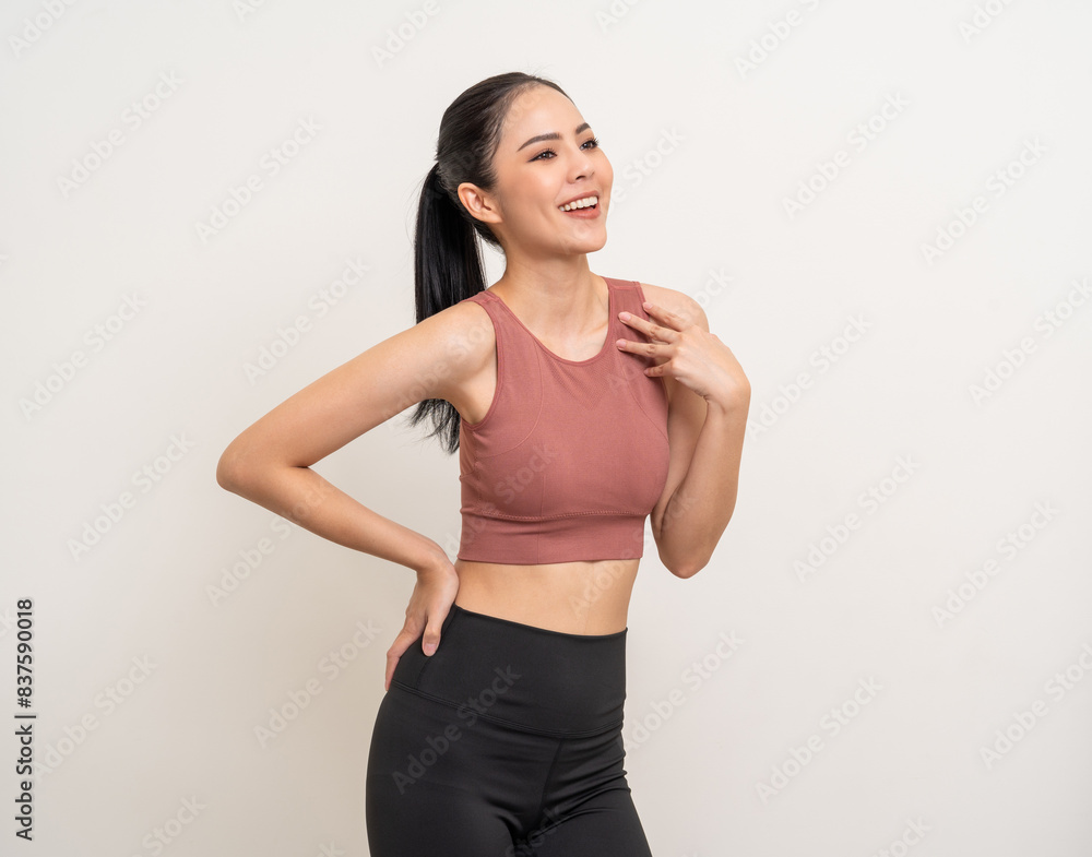 Young beautiful smiling asian woman with sportswear on isolated white background. Portrait happy healthy slim fit and firm latin attractive sporty woman standing pose exercise workout in studio. Young beautiful smiling asian woman with sportswear on isolated white background. Portrait happy healthy slim fit and firm latin attractive sporty woman standing pose exercise workout in studio.