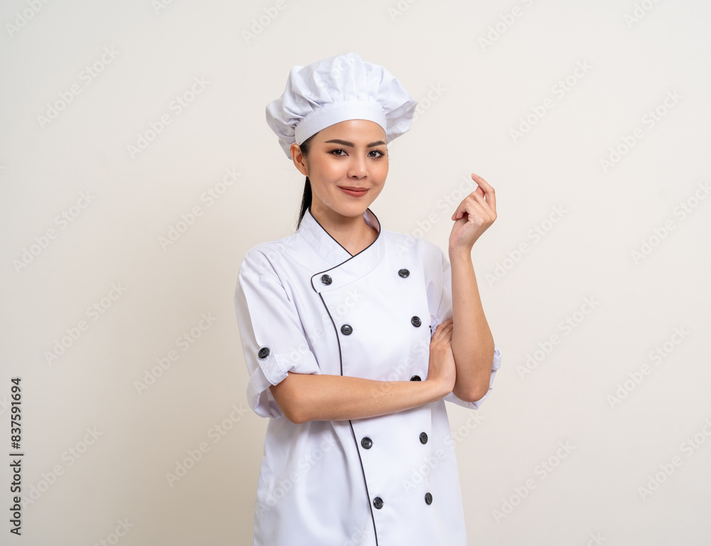 Smiling Young beautiful asian woman chef in uniform casual posing on isolated background. Cooking woman Occupation chef or baker People in kitchen restaurant and hotel. Smiling Young beautiful asian woman chef in uniform casual posing on isolated background. Cooking woman Occupation chef or baker People in kitchen restaurant and hotel.
