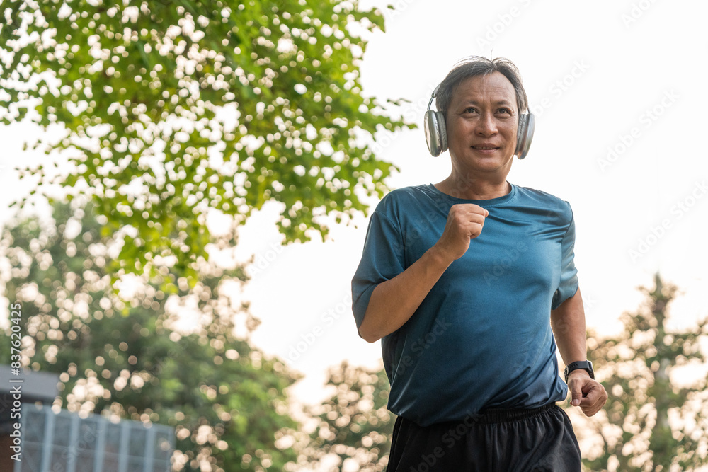 Senior old man runner exercise outdoor nature park. fitness man jogging wearing sportswear. Mature athlete man in sportswear Workout running at public park. Health and activity old man lifestyle Senior old man runner exercise outdoor nature park. fitness man jogging wearing sportswear. Mature athlete man in sportswear Workout running at public park. Health and activity old man lifestyle