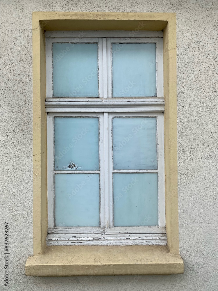 Fototapeta premium Old window whose panes have been made invisible from the inside with a frosted glass cover
