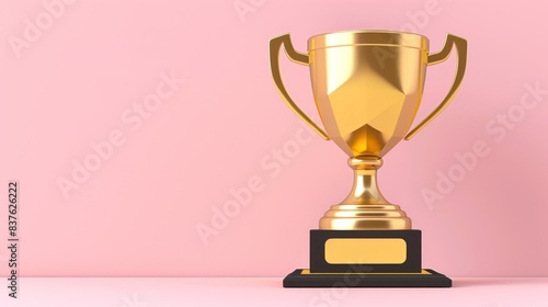 Winner, Golden Cup. A shiny golden trophy sits on a black base in front of a light pink background photo