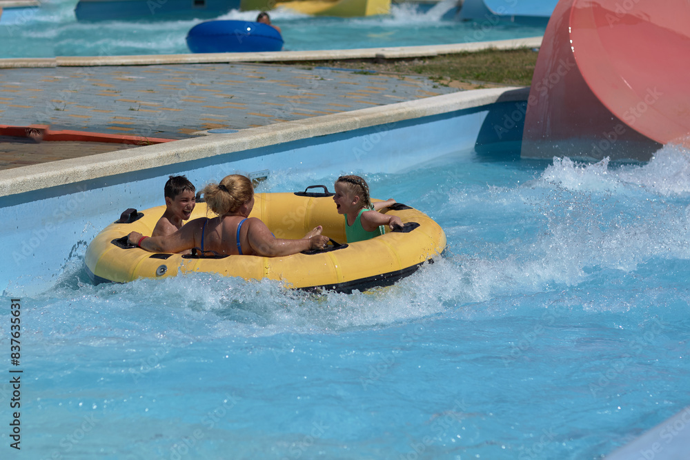Naklejka premium Group of People Riding on a Raft in a Pool