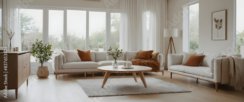 Comfortable and inviting living room flooded with natural light, featuring a cozy seating area ideal for relaxation or hosting visitors