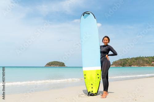 Photography Confidence Asian woman enjoy outdoor active lifestyle water sports surfing on summer holiday vacation