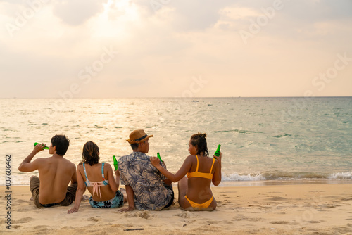 Photography Group of Happy Asian man and woman enjoy and fun outdoor lifestyle travel nature at the sea on summer beach holiday vacation