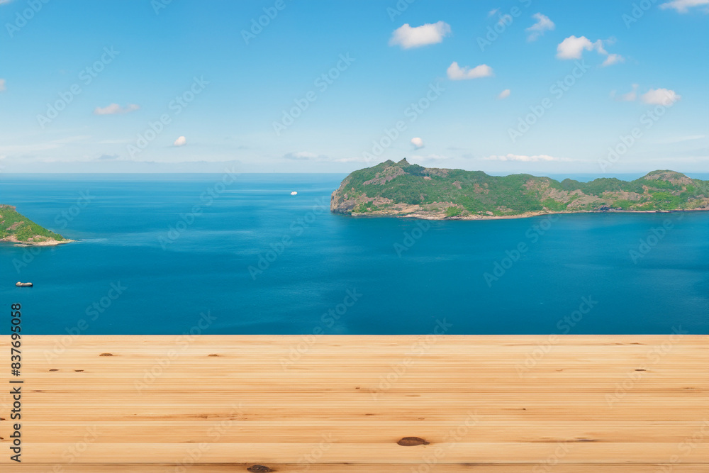 The wooden table offers a panoramic view of the beautiful sea and many islands. The wooden table offers a panoramic view of the beautiful sea and many islands.