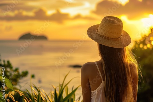 Woman watching sunset over ocean © GoodandEvil