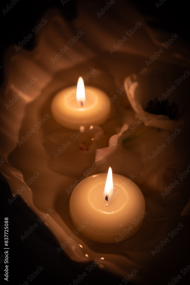 the burning candle on a table the burning candle on a table