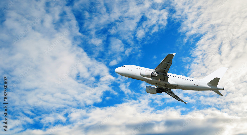 Travel background with airplane flying in the blue sky Travel background with airplane flying in the blue sky