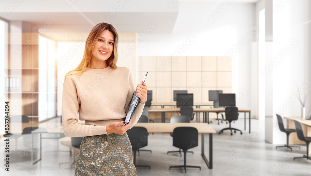 Woman student with notebook in hands, office coworking interior Woman student with notebook in hands, office coworking interior