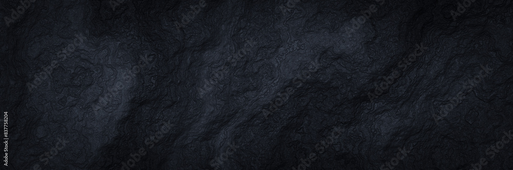 Fototapeta premium Black volcanic rock background. Abstract black cooled lava.