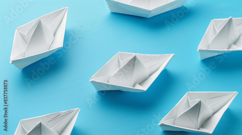 Set of White Origami Ships on Blue Background