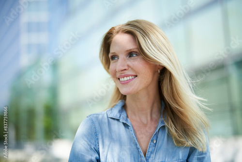 Beautiful blond hair woman wearing denim shirt photo