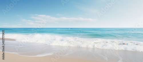 Scenic ocean coast with a sunny beach and white sand, perfect for vacation postcards with copy space image. © meristock
