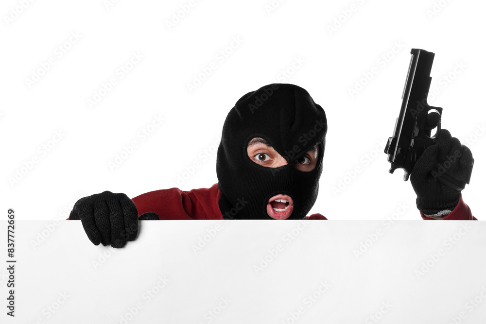 Emotional thief in balaclava with gun on white background Emotional thief in balaclava with gun on white background