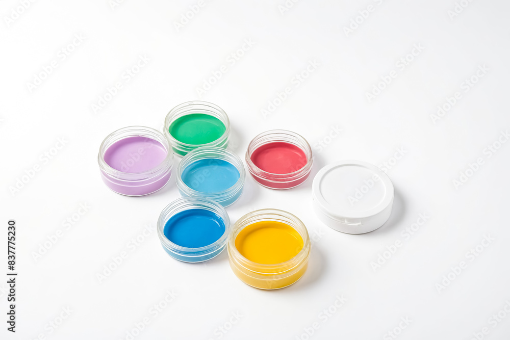 Colorful paint pots on a white background Colorful paint pots on a white background