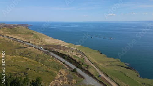 Wallpaper Mural Cars driving over a coastal road at Isle of Skye with a great view of the Ocean. Torontodigital.ca
