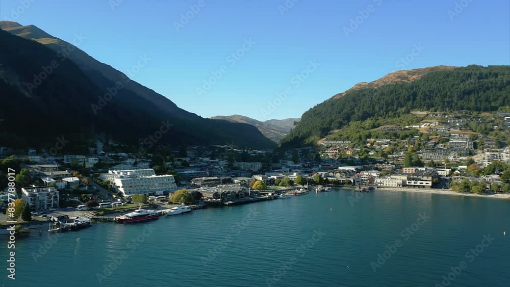 Aerial establishing view of Queenstown, New Zealand on coast of Queenstown Bay. Aerial establishing view of Queenstown, New Zealand on coast of Queenstown Bay.