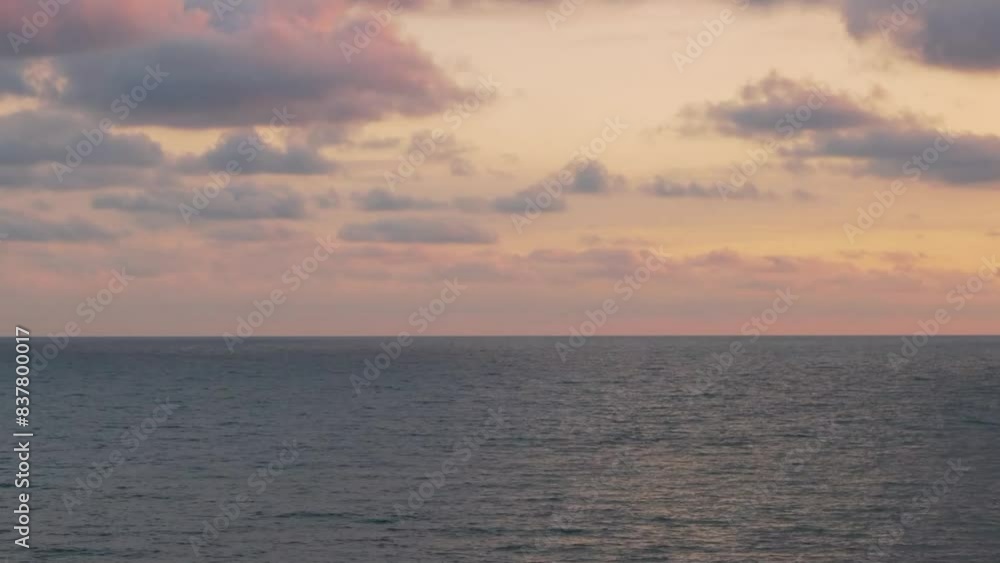 Time Lapse of Beautiful Rain Purple Pink Clouds in Colorful Sunset Sky over the Sea. Ocean and Amazing Colored Sky Cumulus Clouds.Vacation, Relaxation, Beauty, Planet, Travel. Time Lapse of Beautiful Rain Purple Pink Clouds in Colorful Sunset Sky over the Sea. Ocean and Amazing Colored Sky Cumulus Clouds.Vacation, Relaxation, Beauty, Planet, Travel.
