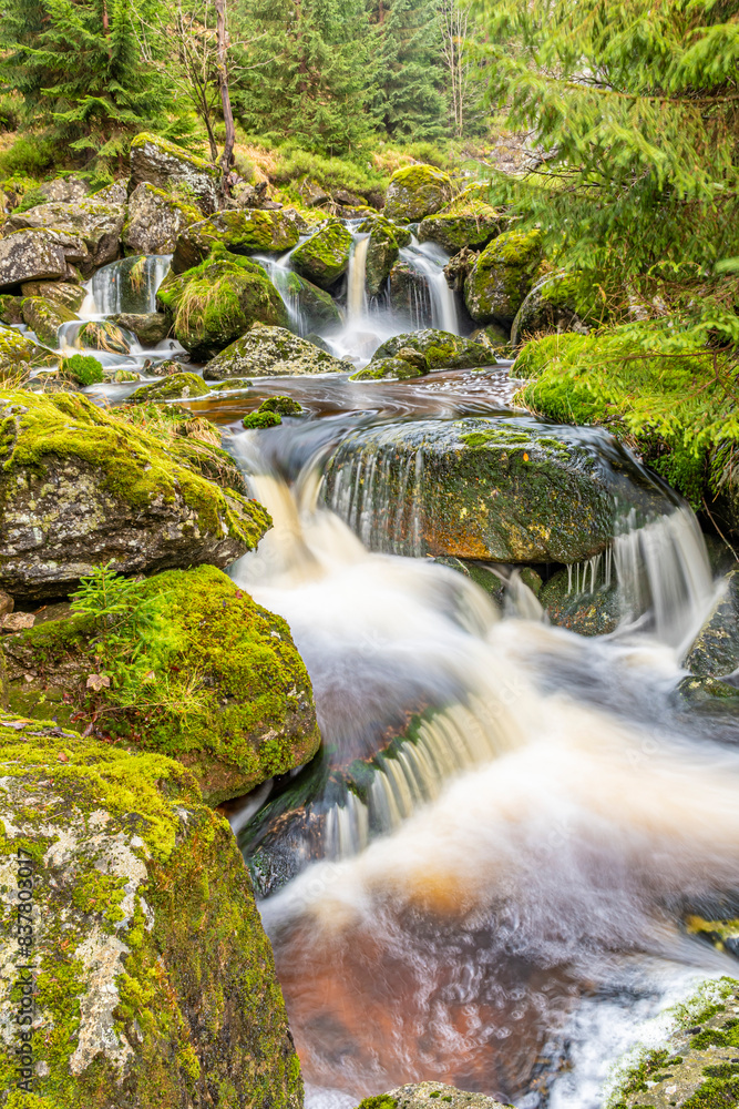Fototapeta premium waterfalls with mossy stones in Jizera mountains on autumn time